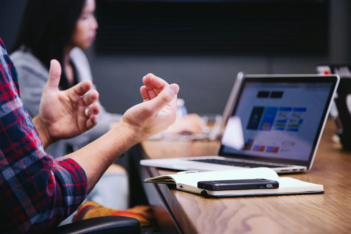 Procurement and finance leaders collaborating over a contract